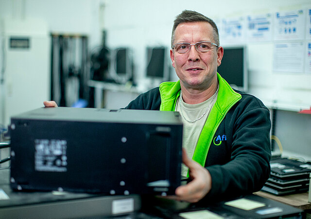 Employee with a refurbished PC